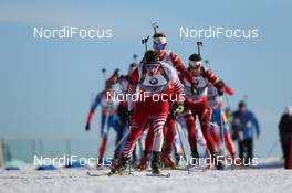 03.03.2013, Oslo, Norway (NOR): Simon Eder (AUT), Fischer, Rottefella, Swix leads the field - IBU world cup biathlon Holmenkollen, mass men, Oslo (NOR). www.nordicfocus.com. © Manzoni/NordicFocus. Every downloaded picture is fee-liable.