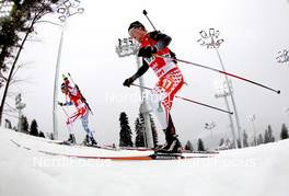 10.03.2013, Sochi, Russia (RUS): Jean Guillaume Beatrix (FRA), Rossignol, Rottefella, One Way, Scott Gow (CAN), Rossignol, Rottefella, Swix - IBU world cup biathlon, relay men, Sochi (RUS). www.nordicfocus.com. © Manzoni/NordicFocus. Every downloaded picture is fee-liable.