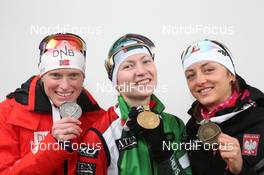 17.02.2013, Nove Mesto, Czech Republic (CZE): L-R: Tora Berger (NOR), Fischer, Rottefella, Odlo, Darya Domracheva (BLR), Fischer, Rottefella, Leki, Monika Hojnisz (POL), Fischer, Rottefella, Alpina, Leki, Casco - IBU world championships biathlon, medals, Nove Mesto (CZE). www.nordicfocus.com. © Manzoni/NordicFocus. Every downloaded picture is fee-liable.