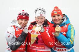 10.02.2013, Nove Mesto, Czech Republic (CZE): L-R: Krystyna Palka (POL), Fischer, Rottefella, Swix, Tora Berger (NOR), Fischer, Rottefella, Odlo, Olena Pidhrushna (UKR), Fischer, Rottefella, Swix - IBU world championships biathlon, medals, Nove Mesto (CZE). www.nordicfocus.com. © Manzoni/NordicFocus. Every downloaded picture is fee-liable.
