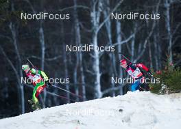 01.12.2013, Oestersund, Sweden (SWE): Darya Domracheva (BLR), Olga Zaitseva (RUS) - IBU world cup biathlon, pursuit women, Oestersund (SWE). www.nordicfocus.com. © Manzoni/NordicFocus. Every downloaded picture is fee-liable.