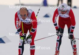 16.03.2013, Oslo, Norway (NOR): Tord Asle Gjerdalen (NOR), Atomic, One Way, Salomon, Swix, Skigo followed by Petter Northug (NOR), Fischer, Swix, Alpina, Rottefella during the last lap - FIS world cup cross-country, mass men, Oslo (NOR). www.nordicfocus.com. © Laiho/NordicFocus. Every downloaded picture is fee-liable.