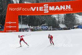 26.02.2013, Val di Fiemme, Italy (ITA):  (l-r) Therese Johaug (NOR), Fischer, Swix, Salomon and Kristin Steira (NOR), Madshus, One Way, Salomon, Swix - FIS nordic world ski championships, cross-country, 10km women, Val di Fiemme (ITA). www.nordicfocus.com. © Laiho/NordicFocus. Every downloaded picture is fee-liable.