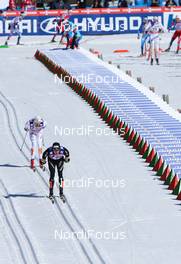 03.03.2013, Val di Fiemme, Italy (ITA): Dario Cologna (SUI), Fischer, Swix, Alpina, Rottefella, Odlo followed by Johan Olsson (SWE), Fischer, Swix, Alpina, Rottefella, Craft - FIS nordic world ski championships, cross-country, mass men, Val di Fiemme (ITA). www.nordicfocus.com. © Laiho/NordicFocus. Every downloaded picture is fee-liable.
