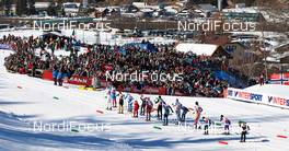 01.03.2013, Val di Fiemme, Italy (ITA): the big group passes spectators - FIS nordic world ski championships, cross-country, 4x10km men, Val di Fiemme (ITA). www.nordicfocus.com. © Felgenhauer/NordicFocus. Every downloaded picture is fee-liable.