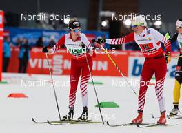 28.02.2013, Val di Fiemme, Italy (ITA):  (l-r) Teresa Stadlober (AUT), Fischer, Swix, Loeffler and Katerina Smutna (AUT), Fischer One Way, Alpina, Rottefella, Loeffler - FIS nordic world ski championships, cross-country, 4x5km women, Val di Fiemme (ITA). www.nordicfocus.com. © Laiho/NordicFocus. Every downloaded picture is fee-liable.