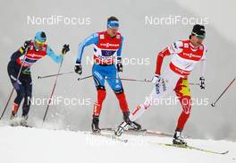 24.02.2013, Val di Fiemme, Italy (ITA): Alex Harvey (CAN), Fischer, Swix, Salomon, One Way followed by Nikita Kriukov (RUS), Rossignol, Swix, Rottefella, Adidas and Alexey Poltoranin (KAZ), Fischer, Swix, Rottefella - FIS nordic world ski championships, cross-country, team sprint, Val di Fiemme (ITA). www.nordicfocus.com. © Laiho/NordicFocus. Every downloaded picture is fee-liable.