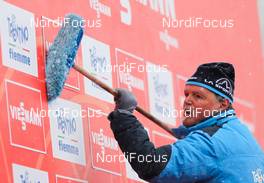 24.02.2013, Val di Fiemme, Italy (ITA): cleaning the sponsors  - FIS nordic world ski championships, cross-country, team sprint, Val di Fiemme (ITA). www.nordicfocus.com. © Laiho/NordicFocus. Every downloaded picture is fee-liable.