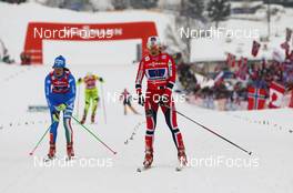 24.02.2013, Val di Fiemme, Italy (ITA):  (l-r) Ilaria Debertolis (ITA), Fischer, KV+, Alpina, Rottefella and Maiken Caspersen Falla (NOR), Fischer, Swix, Alpina, Rottefella - FIS nordic world ski championships, cross-country, team sprint, Val di Fiemme (ITA). www.nordicfocus.com. © Laiho/NordicFocus. Every downloaded picture is fee-liable.