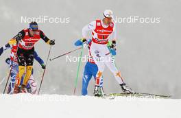 24.02.2013, Val di Fiemme, Italy (ITA): Marcus Hellner (SWE), Fischer, Swix, Salomon, Craft followed by Tim Tscharnke (GER), Fischer, Swix, Alpina, Rottefella, Adidas  - FIS nordic world ski championships, cross-country, team sprint, Val di Fiemme (ITA). www.nordicfocus.com. © Laiho/NordicFocus. Every downloaded picture is fee-liable.
