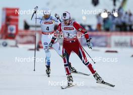 01.12.2013, Kuusamo, Finland (FIN): Therese Johaug (NOR), Fischer, Swix, Rottefella followed by Charlotte Kalla (SWE), Fischer, Swix, Salomon, Craft - FIS world cup cross-country, pursuit women, Kuusamo (FIN). www.nordicfocus.com. © Laiho/NordicFocus. Every downloaded picture is fee-liable.