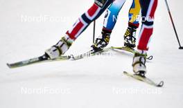 01.12.2013, Kuusamo, Finland (FIN): Fischer and Salomon boots with Charlotte Kalla (SWE) - FIS world cup cross-country, pursuit women, Kuusamo (FIN). www.nordicfocus.com. © Felgenhauer/NordicFocus. Every downloaded picture is fee-liable.
