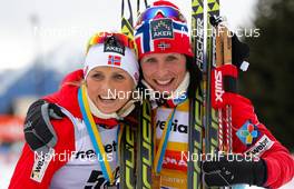 14.12.2013, Davos, Switzerland (SUI): (l-r) Therese Johaug (NOR), Fischer, Swix, Rottefella and Marit Bjoergen (NOR), Fischer, Swix, Rottefella  - FIS world cup cross-country, 15km women, Davos (SUI). www.nordicfocus.com. © Laiho/NordicFocus. Every downloaded picture is fee-liable.