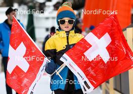 15.12.2013, Davos, Switzerland (SUI): a boy with the swiss flags - FIS world cup cross-country, individual sprint, Davos (SUI). www.nordicfocus.com. © Laiho/NordicFocus. Every downloaded picture is fee-liable.