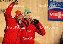 02.03.2013, Val di Fiemme, Italy (ITA): (l-r) Wilhelm Denifl (AUT), Salomon, Leki, Loeffler and Bernhard Gruber (AUT), Fischer, Rottefella, Loeffler - FIS nordic world ski championships, nordic combined, team sprint HS134/2x7.5km, Val di Fiemme (ITA). www.nordicfocus.com. © Laiho/NordicFocus. Every downloaded picture is fee-liable.
