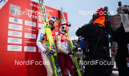 30.11.2013, Kuusamo, Finland (FIN): (l-r) Haavard Klemetsen (NOR), Fischer, Swix, Alpina, Rottefella and Akito Watabe (JPN), Fischer, Swix, Rottefella on the leader board - FIS world cup nordic combined, team HS142/4x5km, Kuusamo (FIN). www.nordicfocus.com. © Laiho/NordicFocus. Every downloaded picture is fee-liable.