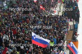 23.03.2013, Planica, Slovenia (SLO): Event Feature: A slovenian flag in the crowd - FIS world cup ski flying, team HS215, Planica (SLO). www.nordicfocus.com. © Manzoni/NordicFocus. Every downloaded picture is fee-liable.