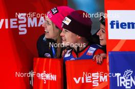 22.02.2013, Val di Fiemme, Italy (ITA): (l-r) Abby Hughes (USA), Lindsey Van (USA) and Jessica Jerome (USA) waiting for the result of Sarah Hendrickson  - FIS nordic world ski championships, ski jumping ladies, individual HS106, Val di Fiemme (ITA). www.nordicfocus.com. © Laiho/NordicFocus. Every downloaded picture is fee-liable.