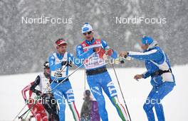 20.01.2013, Lienz, Austria (AUT): Fabio Santus (ITA), gets some drinks - FIS Marathon Cup Dolomitenlauf, Lienz (AUT). www.nordicfocus.com. © Felgenhauer/NordicFocus. Every downloaded picture is fee-liable.
