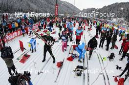 27.01.2013, Val di Fassa/Val di Fiemme, Italy (ITA): preparations for the start, Jorgen Aukland lifts his ski - FIS Marathon Cup Marcialonga, Val di Fassa/Val di Fiemme (ITA). www.nordicfocus.com. © Rauschendorfer/NordicFocus. Every downloaded picture is fee-liable.