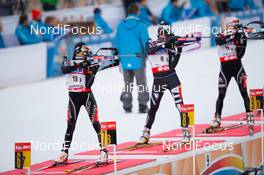 08.01.2014, Ruhpolding, Germany (GER): Aita Gasparin (SUI), Nicole Gontier (ITA), Mari Laukkanen (FIN)  - IBU world cup biathlon, relay women, Ruhpolding (GER). www.nordicfocus.com. © Manzoni/NordicFocus. Every downloaded picture is fee-liable.