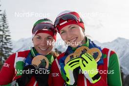 21.02.2014, Sochi, Russia (RUS): Nadezhda Skardino (BLR), Darya Domracheva (BLR) - XXII. Olympic Winter Games Sochi 2014, biathlon, medals, Sochi (RUS). www.nordicfocus.com. © NordicFocus. Every downloaded picture is fee-liable.
