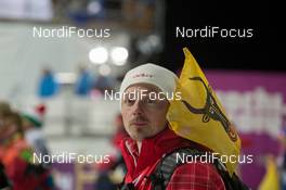 09.02.2014, Sochi, Russia (RUS): Event Feature: Pascal Huber (SUI), physio Team Switzerland with Flag of Kanton Uri - XXII. Olympic Winter Games Sochi 2014, biathlon, sprint women, Sochi (RUS). www.nordicfocus.com. © NordicFocus. Every downloaded picture is fee-liable.