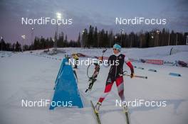 28.11.2014, Oestersund, Sweden (SWE): Event Feature: Athlete taks the rifle of the rack - IBU world cup biathlon, training, Oestersund (SWE). www.nordicfocus.com. © Manzoni/NordicFocus. Every downloaded picture is fee-liable.