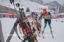 10.12.2014, Hochfilzen, Austria (AUT): Event Feature: Undefined Athelte takes a riffle off the rack - IBU world cup biathlon, training, Hochfilzen (AUT). www.nordicfocus.com. © Manzoni/NordicFocus. Every downloaded picture is fee-liable.
