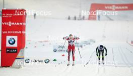 04.01.2014, Val di Fiemme, Italy (ITA): Therese Johaug (NOR), Coraline Hugue (FRA), (l-r) - FIS world cup cross-country, tour de ski, 5km women, Val di Fiemme (ITA). www.nordicfocus.com. © Felgenhauer/NordicFocus. Every downloaded picture is fee-liable.