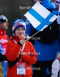 01.03.2014, Lahti, Finland (FIN): a boy with a finnish flag - FIS world cup cross-country, individual sprint, Lahti (FIN). www.nordicfocus.com. © Laiho/NordicFocus. Every downloaded picture is fee-liable.