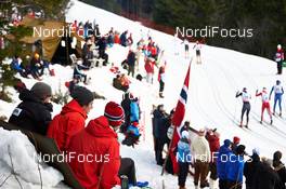 08.03.2014, Oslo, Norway (NOR): athletes pass norwegian fans - FIS world cup cross-country, mass men, Oslo (NOR). www.nordicfocus.com. © Felgenhauer/NordicFocus. Every downloaded picture is fee-liable.