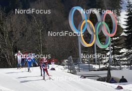 23.02.2014, Sochi, Russia (RUS): the first group passes the olympic rings - XXII. Olympic Winter Games Sochi 2014, cross-country, 50km men, Sochi (RUS). www.nordicfocus.com. © NordicFocus. Every downloaded picture is fee-liable.