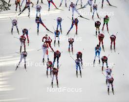 23.02.2014, Sochi, Russia (RUS): a big group of athletes in the first downhill - XXII. Olympic Winter Games Sochi 2014, cross-country, 50km men, Sochi (RUS). www.nordicfocus.com. © NordicFocus. Every downloaded picture is fee-liable.