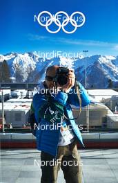 11.02.2014, Sochi, Russia (RUS): Event Feature: photographer in front of Laura biathlon stadium - XXII. Olympic Winter Games Sochi 2014, cross-country, training, Sochi (RUS). www.nordicfocus.com. © NordicFocus. Every downloaded picture is fee-liable.