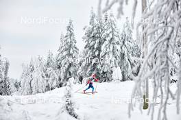 30.11.2014, Ruka, Finland (FIN): Natalia Korosteleva (RUS),  racing in white woods - FIS world cup cross-country, 10km women, Ruka (FIN). www.nordicfocus.com. © Felgenhauer/NordicFocus. Every downloaded picture is fee-liable.