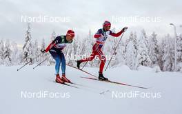 30.11.2014, Ruka, Finland (FIN): (l-r) Evgeniy Belov (RUS), Fischer, Swix, Alpina, Rottefella, Adidas and Simen Oestensen (NOR) - FIS world cup cross-country, 15km men, Ruka (FIN). www.nordicfocus.com. © Laiho/NordicFocus. Every downloaded picture is fee-liable.