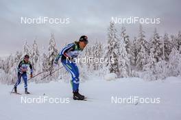 30.11.2014, Ruka, Finland (FIN): Matias Strandvall (FIN), Fischer, Swix, Salomon followed by Juho Mikkonen (FIN), Rossignol, Rottefella, Exel - FIS world cup cross-country, 15km men, Ruka (FIN). www.nordicfocus.com. © Laiho/NordicFocus. Every downloaded picture is fee-liable.