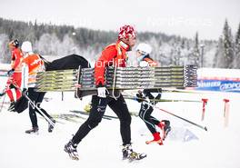 05.12.2014, Lillehammer, Norway (NOR): canadien service man on a quick run back to the waxing cabin - FIS world cup cross-country, training, Lillehammer (NOR). www.nordicfocus.com. © Felgenhauer/NordicFocus. Every downloaded picture is fee-liable.