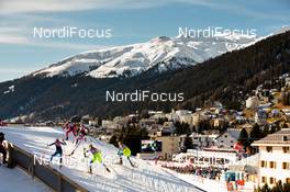 21.12.2014, Davos, Switzerland (SUI): a group of skiers at the track with panorama towards the village - FIS world cup cross-country, individual sprint, Davos (SUI). www.nordicfocus.com. © Laiho/NordicFocus. Every downloaded picture is fee-liable.