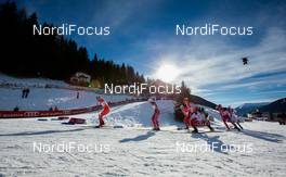 21.12.2014, Davos, Switzerland (SUI): a group of skiers i a curve - FIS world cup cross-country, individual sprint, Davos (SUI). www.nordicfocus.com. © Laiho/NordicFocus. Every downloaded picture is fee-liable.