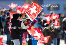21.12.2014, Davos, Switzerland (SUI): boys with swiss flags - FIS world cup cross-country, individual sprint, Davos (SUI). www.nordicfocus.com. © Laiho/NordicFocus. Every downloaded picture is fee-liable.