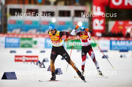 20.12.2014, Ramsau, Austria (AUT): Tino Edelmann (GER), Lukas Klapfer (AUT), (l-r)  - FIS world cup nordic combined, team sprint HS98/2x7.5km, Ramsau (AUT). www.nordicfocus.com. © Felgenhauer/NordicFocus. Every downloaded picture is fee-liable.
