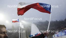15.03.2014, Harrachov, Czech Republic (CZE): spectator waves his flag at the venue as he waits for the competition - FIS ski flying world championships, ski jumping, individual HS205, Harrachov (CZE). www.nordicfocus.com. © Domanski/NordicFocus. Every downloaded picture is fee-liable.