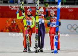 11.02.2014, Sochi, Russia (RUS): (l-r) Daniela Iraschko-Stolz (AUT), Fischer, Carina Vogt (GER), Fischer and Coline Mattel (FRA), Fluege.de - XXII. Olympic Winter Games Sochi 2014, ski jumping ladies, individual HS106, Sochi (RUS). www.nordicfocus.com. © NordicFocus. Every downloaded picture is fee-liable.