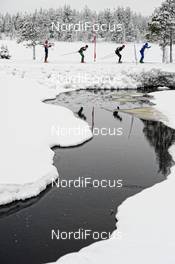 02.03.2014, Mora, Sweden (SWE): group of athletes pass a    small river - FIS Marathon Cup Vasaloppet, Mora (SWE). www.nordicfocus.com. © Rauschendorfer/NordicFocus. Every downloaded picture is fee-liable.