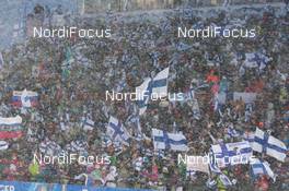 07.03.2015, Kontiolahti, Finland (FIN): Event Feature: Finnish fans with flags in the snow - IBU world championships biathlon, sprint women, Kontiolahti (FIN). www.nordicfocus.com. © NordicFocus. Every downloaded picture is fee-liable.