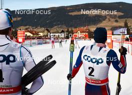 08.01.2015, Cortina-Toblach, Italy (ITA): Calle Halfvarsson (SWE), Martin Johnsrud Sundby (NOR),  watching the sprint of the second group - FIS world cup cross-country, tour de ski, pursuit men, Cortina-Toblach (ITA). www.nordicfocus.com. © Felgenhauer/NordicFocus. Every downloaded picture is fee-liable.