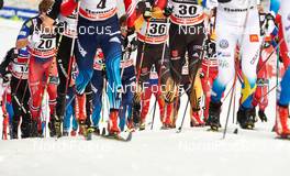 10.01.2015, Val di Fiemme, Italy (ITA): lots of feet and skis in the uphill - FIS world cup cross-country, tour de ski, mass men, Val di Fiemme (ITA). www.nordicfocus.com. © Felgenhauer/NordicFocus. Every downloaded picture is fee-liable.