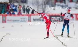 24.01.2015, Rybinsk, Russia (RUS): (l-r) Federico Pellegrino (ITA), Rossignol, Rottefella and Sergey Ustiugov (RUS), Fischer, Swix, Rottefella, Adidas - FIS world cup cross-country, individual sprint, Rybinsk (RUS). www.nordicfocus.com. © Laiho/NordicFocus. Every downloaded picture is fee-liable.